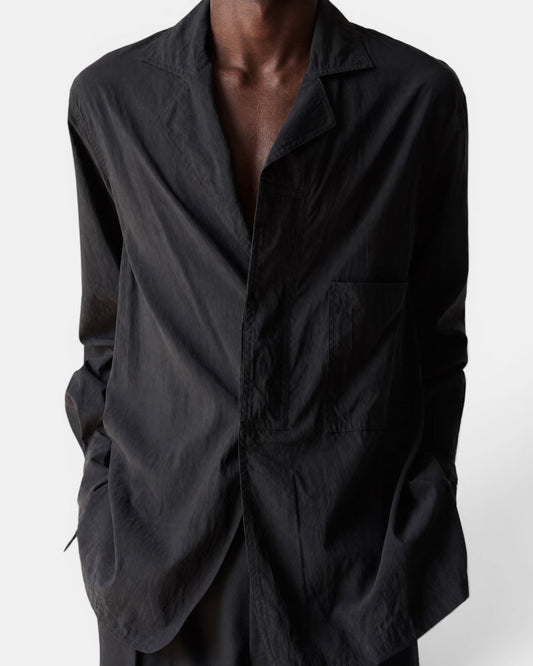 NAMELESS black suit-collar wide-sleeved shirt with a chest pocket, worn by a model.