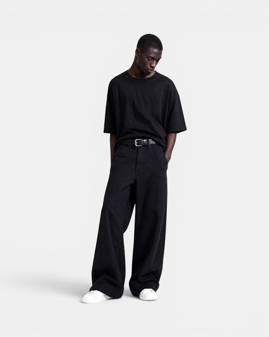 NAMELESS black washed denim wide-leg jeans on a male model with a relaxed fit and five-pocket design.
