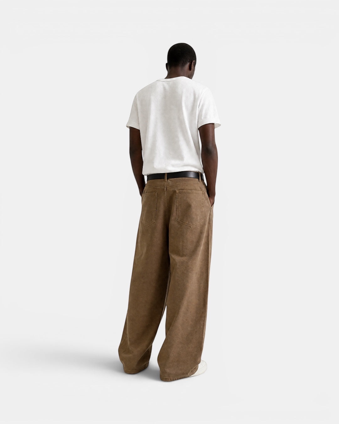 NAMELESS brown washed denim wide-leg jeans on a man, featuring a relaxed fit and classic five-pocket design.