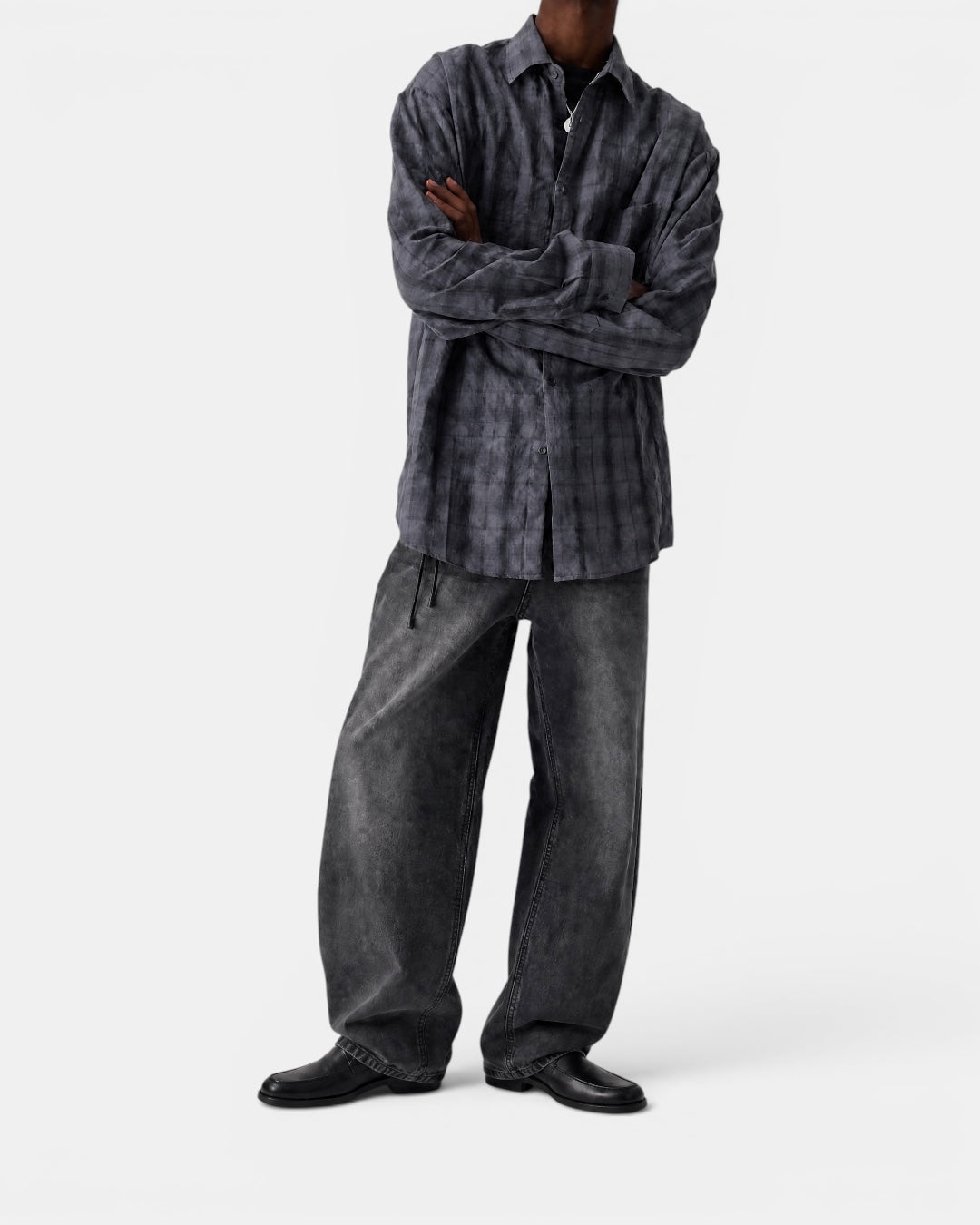 Nameless vintage grey textured checkered long-sleeve shirt worn by a man with arms crossed.