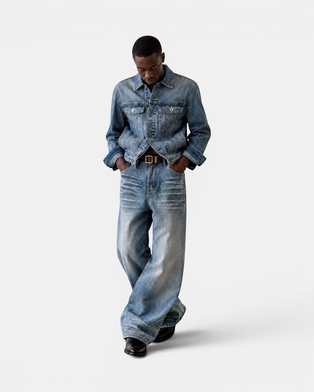 NAMELESS light wash distressed denim wide-leg jeans with authentic whiskering and fading.