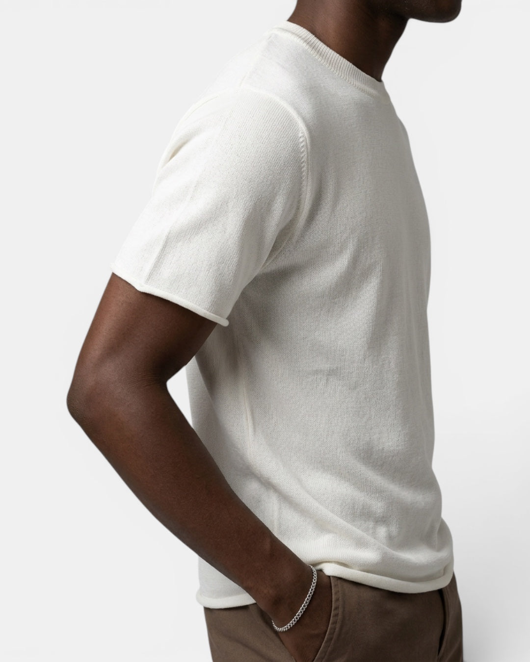 NAMELESS off-white knit short-sleeve top with cuffed hem, made from a cotton-nylon blend.