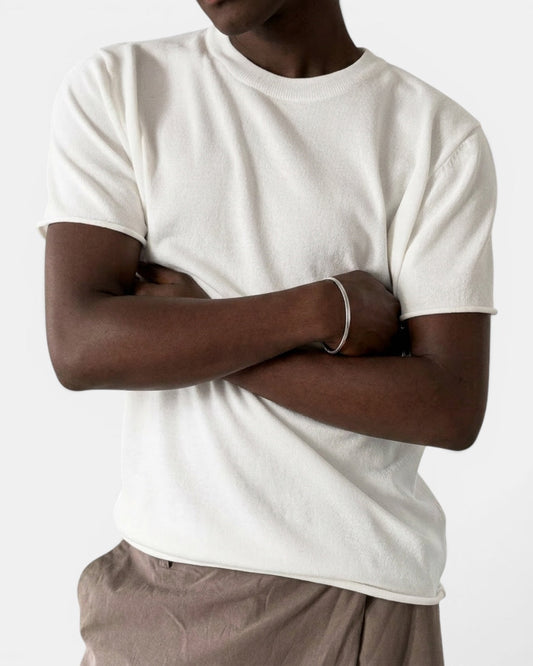 NAMELESS off-white short-sleeve knit top with cuffed sleeves and a relaxed fit, made from a cotton-nylon blend.